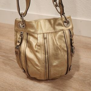 B. Makowsky gold metallic leather crossbody bag featuring silver-toned hardware